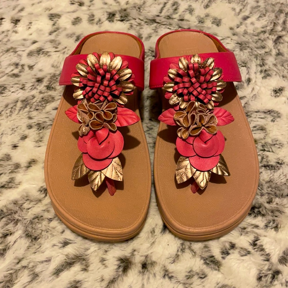 Beautiful pink with flower design on top of sandals by Fitflop!